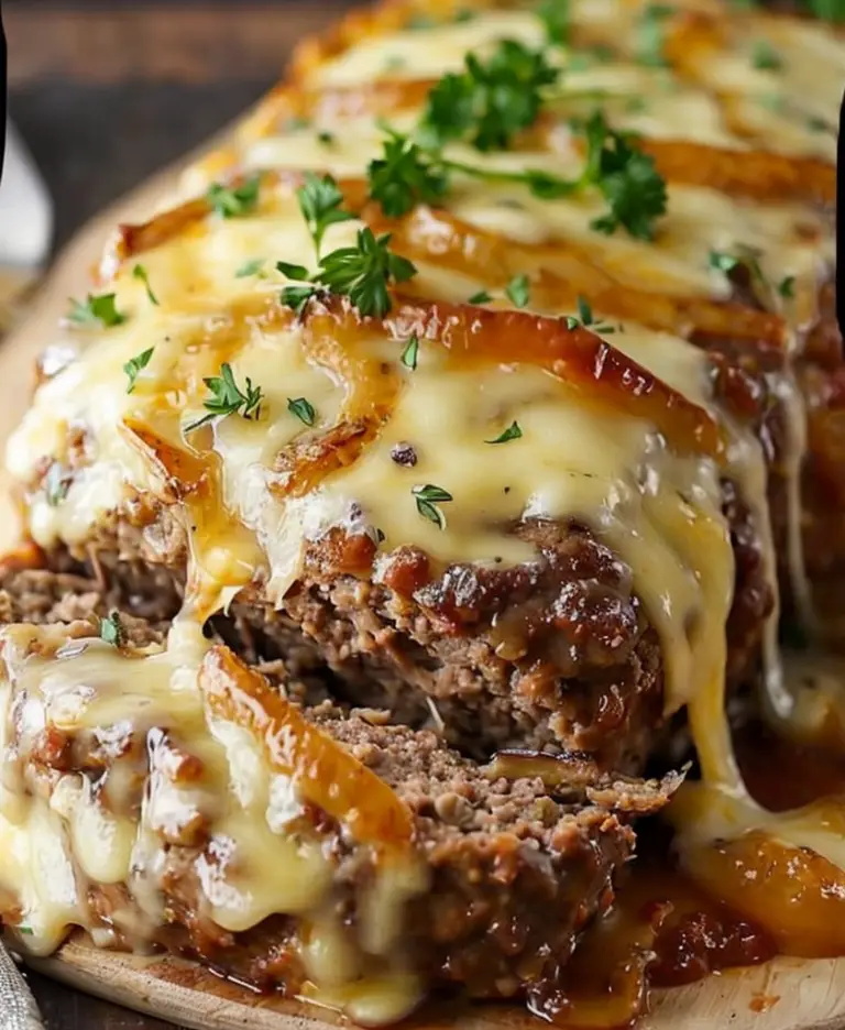 Savory Crockpot French Onion Meatloaf Topped with Swiss Cheese