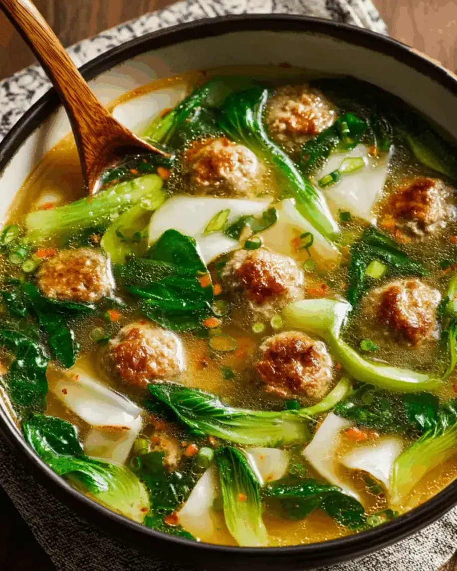Ginger Chicken Meatball Soup with Baby Bok Choy and Wonton Strips