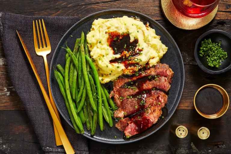 Succulent Ribeye Steak with Roasted Garlic Sauce