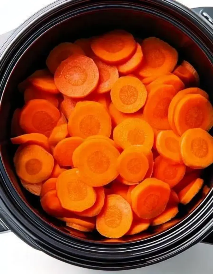 Tender slow-cooked carrots glazed with butter, cinnamon, and brown sugar