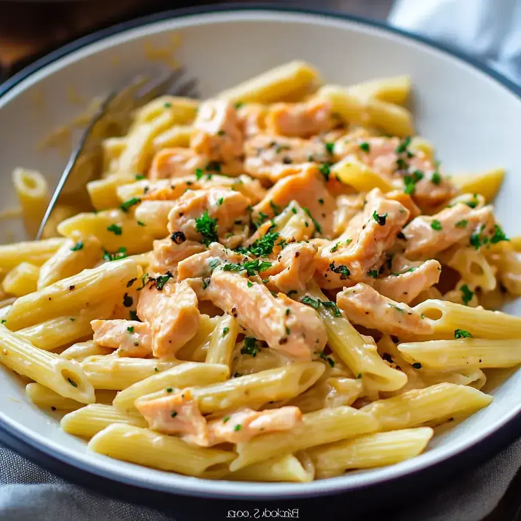 Overhead view of finished creamy salmon pasta dish ready to serve