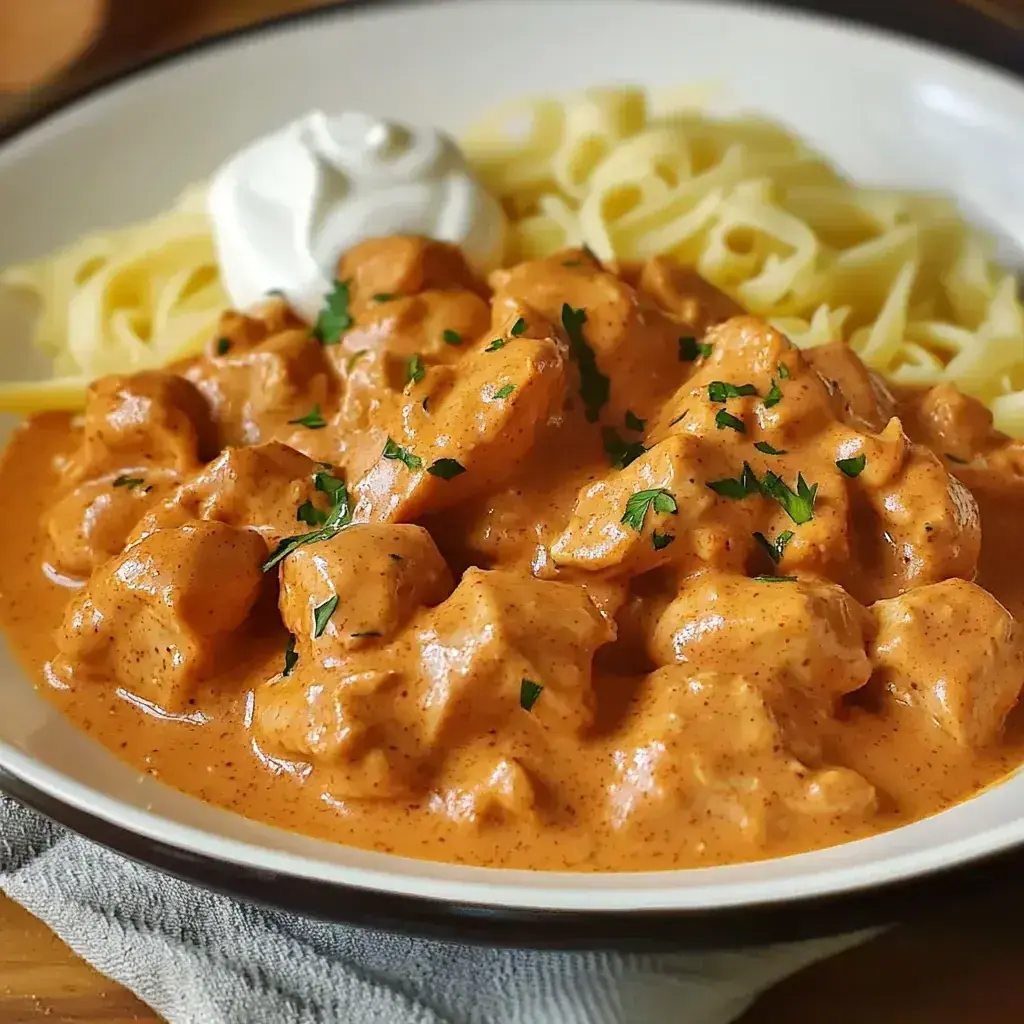 Chicken Paprikash served on a plate with sides