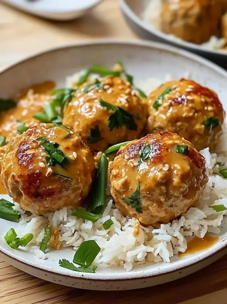 Juicy Thai Chicken Meatballs in Creamy Peanut Sauce